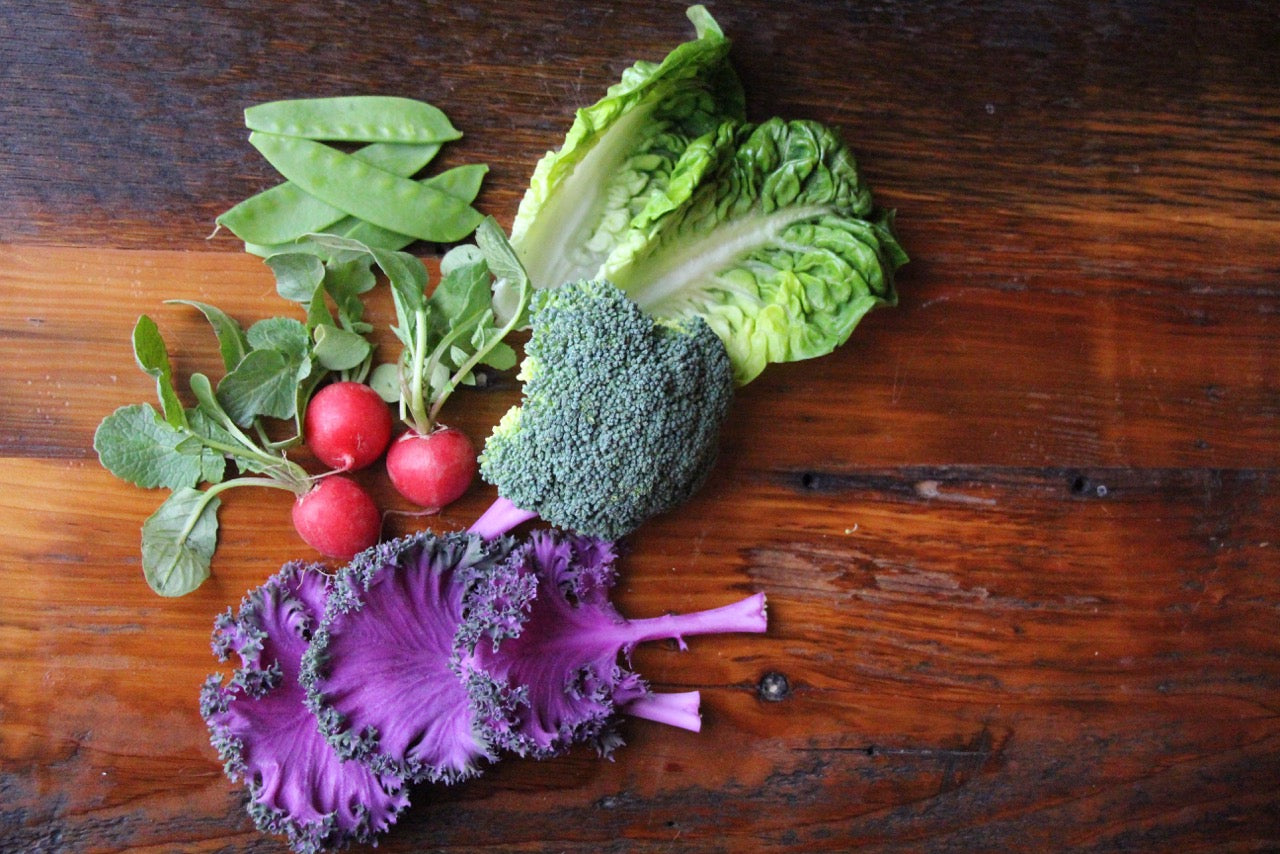 Spring vegetables grown in fabric aeration container